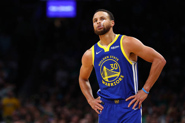 Stephen Curry of the Golden State Warriors looks on against the Boston Celtics during the first quarter in Game Six of the 2022 NBA Finals at TD...