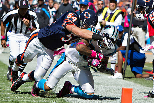 Steve Smith of the Carolina Panthers is hit by Brian Urlacher of the Chicago Bears at Soldier Field on October 2, 2011 in Chicago, Illinois. The...