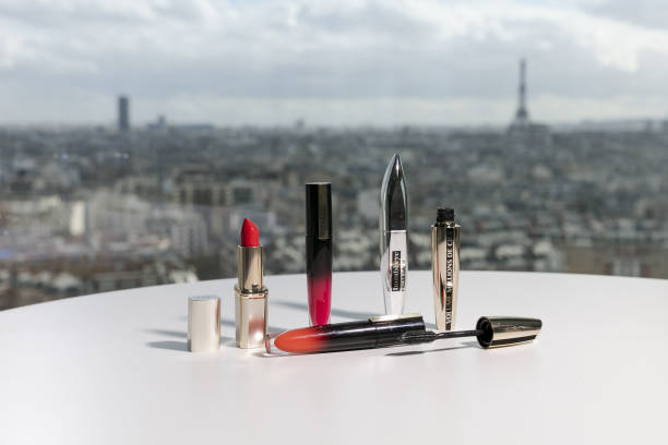 sticks of lipstick and bottles of mascara manufactured by loreal sit picture