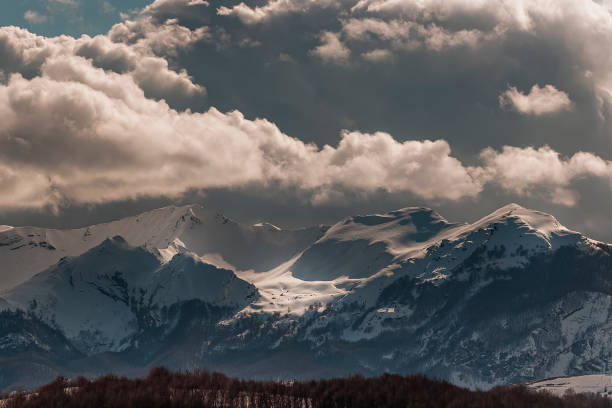 A storm is brewing,Scenic view of snowcapped mountains against sky