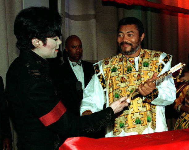 Superstar singer Michael Jackson presents a gold sword to the President of the West African nation of Ghana Jerry Rawlings on behalf of Saudi Arabian...