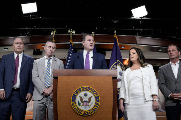 Surrounded by Republican members of the House Intelligence Committee, ranking member of the House Intelligence Committee Rep. Mike Turner speaks...