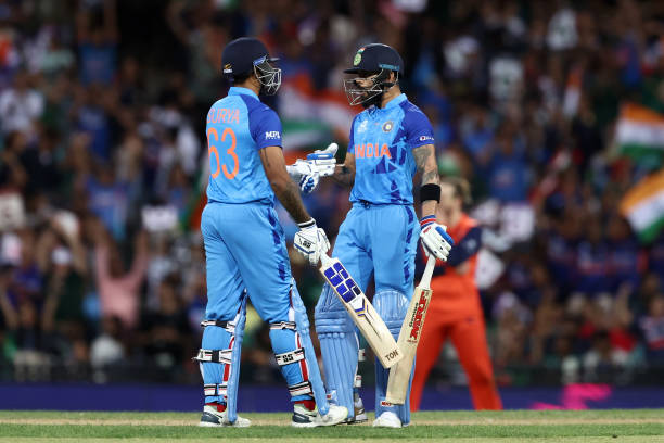 Suryakumar Yadav and Virat Kohli of India touch gloves during the ICC Men's T20 World Cup match between India and Netherlands at Sydney Cricket...