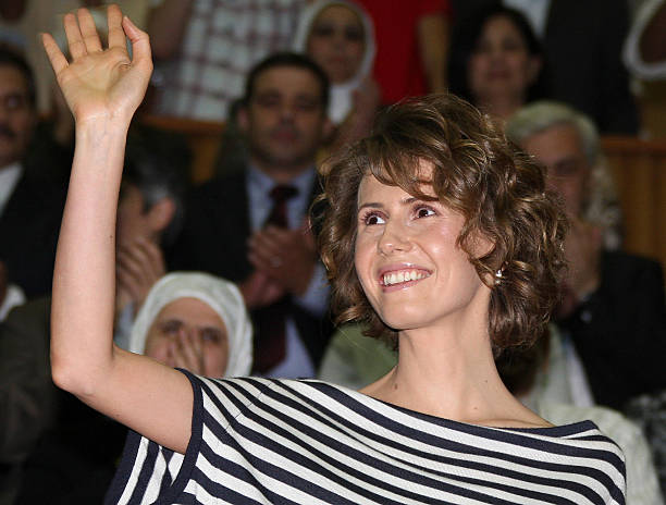 Syrian First Lady Asma al-Assad waves as she attends the opening ceremony of the Syrian Special Olympics for mentally challenged athletes in Damascus...