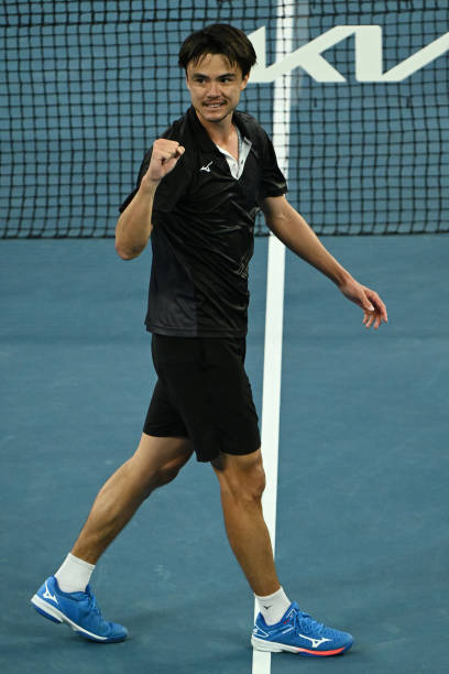 Taro Daniel of Japan celebrates match point in his second round singles match against Andy Murray of Great Britain during day four of the 2022...