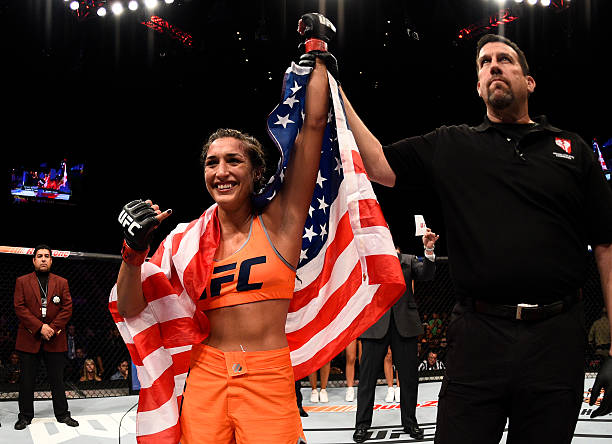 Tatiana Suarez celebrates after her submission victory over Amanda Cooper in their women's strawweight bout during The Ultimate Fighter Finale event...