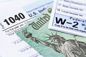 IRS tax forms with tax refund check