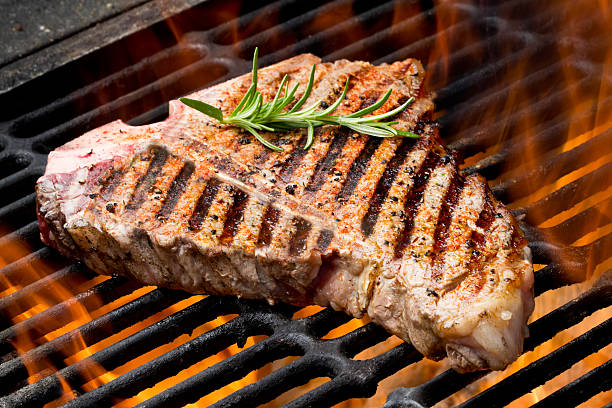 tbone steak on grill with flames picture id166043306?k=20&m=166043306&s=612x612&w=0&h=u6psjvvD9jb fi8BCgwOu4LB9YlVp qfmLLyTUy2eKQ=