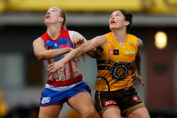 Tegan Cunningham of the Hawks and Celine Moody of the Bulldogs compete for the ball during the 2022 S7 AFLW Round 04 match between the Hawthorn Hawks...