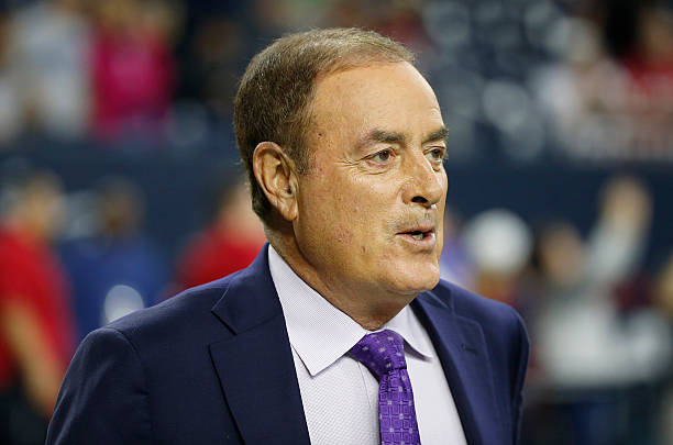 Television announcer Al Michaels watches the Houston Texans warm up before the Texans play the New England Patriots on December 13, 2015 at NRG...