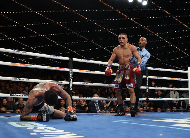 Teofimo Lopez knocks down George Kambosos in the tenth round during their championship bout for Lopez’s Undisputed Lightweight title at The Hulu...