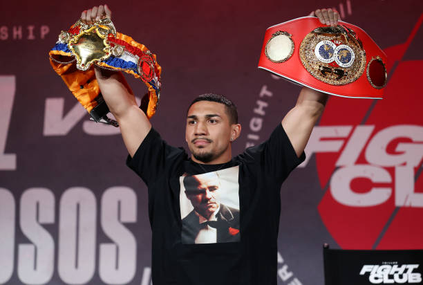 Teofimo Lopez poses with his championship belts during a press conference for Triller Fight Club at Mercedes-Benz Stadium on April 16, 2021 in...