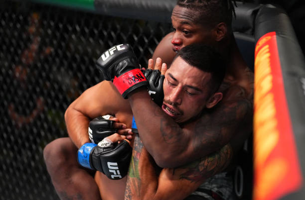 Terrance McKinney works for a rear choke submission against Erick Gonzalez in a lightweight fight during the UFC Fight Night event at UFC APEX on...
