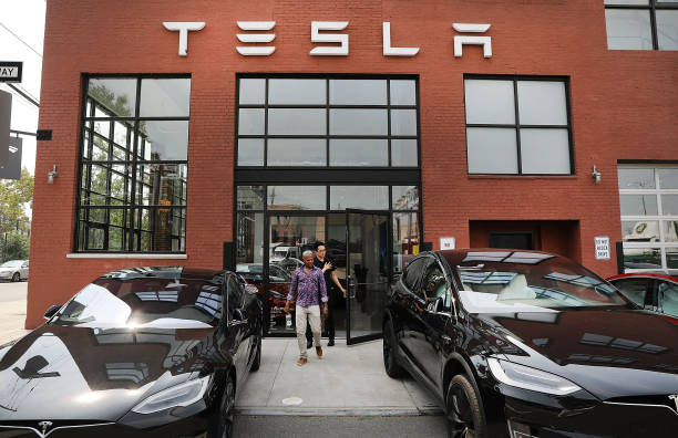 Tesla vehicles stand outside of a Brooklyn showroom and service center on August 27, 2018 in New York City. The electric automaker saw its stock drop...