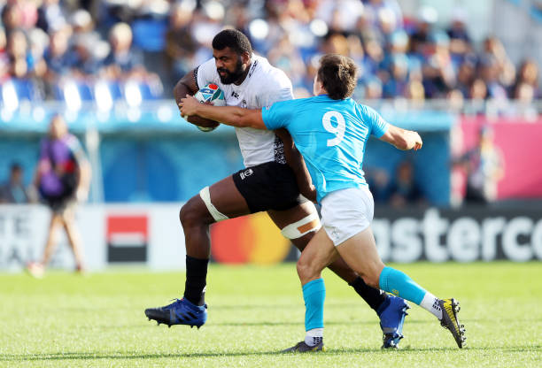 KAMAISHI, JAPAN - SEPTEMBER 25: Tevita Ratuva runs past Santiago Arata of Uruguay during the Rugby World Cup 2019 Group D game between Fiji and Uruguay at Kamaishi Recovery Memorial Stadium on September 25, 2019 in Kamaishi, Iwate, Japan. (Photo by Warren Little - World Rugby/World Rugby via Getty Images)