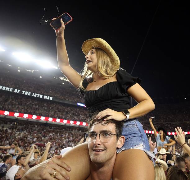 Texas A&M Aggies fans storm the field after defeating the Alabama Crimson Tide 41-38 at Kyle Field on October 09, 2021 in College Station, Texas.