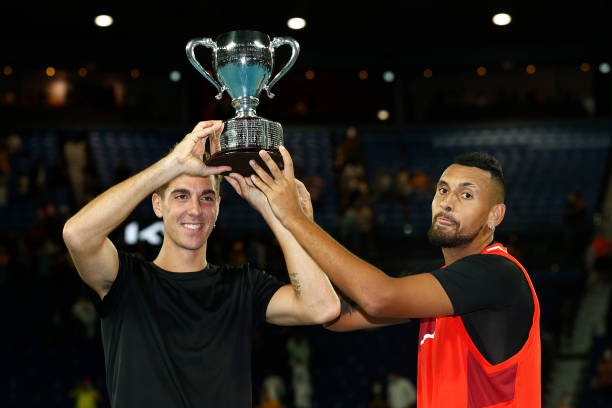 Thanasi Kokkinakis of Australia and Nick Kyrgios of Australia pose with the championship trophy after winning their Men's Doubles Final match against...