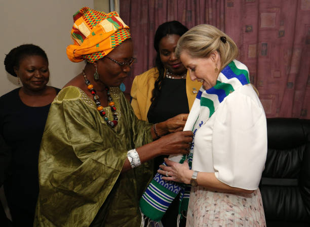 The Countess of Wessex receives a gift of an embroidered sash from members of a women's parliamentary group in Parliament Freetown on the first day...'s parliamentary group in Parliament Freetown on the first day...