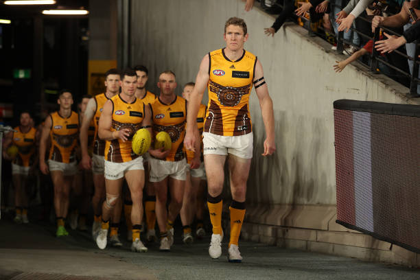 The Hawks head out during the round 17 AFL match between the Hawthorn Hawks and the Adelaide Crows at Marvel Stadium on July 10, 2022 in Melbourne,...