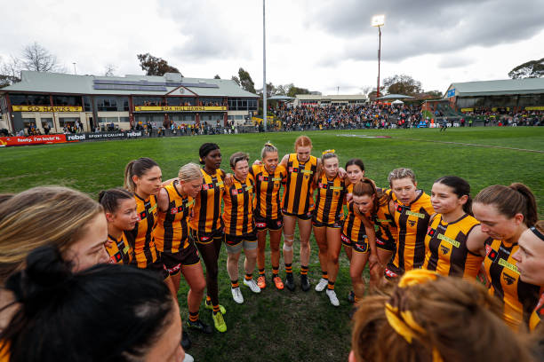The Hawks huddle during the 2022 S7 AFLW Round 02 match between the Hawthorn Hawks and the St Kilda Saints at Box Hill City Oval on September 4, 2022...
