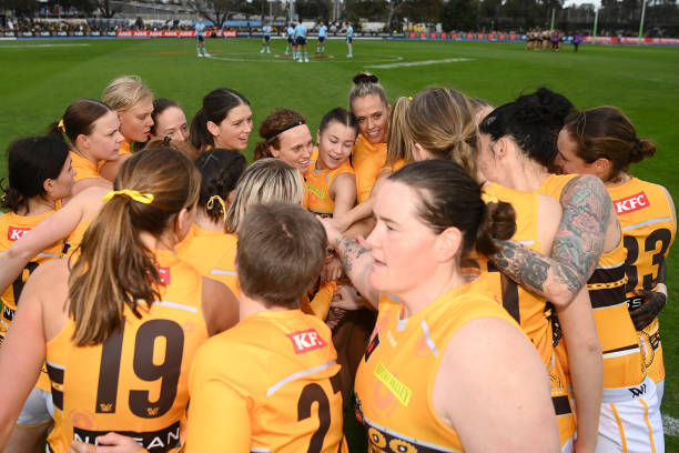 The Hawks huddle together before the round three AFLW match between the Richmond Tigers and the Hawthorn Hawks at Punt Road Oval on September 11,...