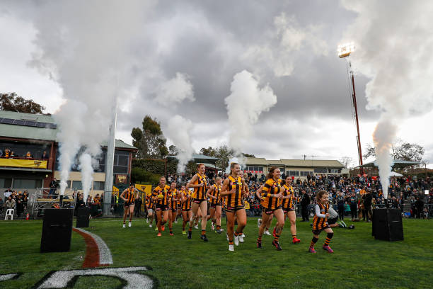 The Hawks run on to the field during the 2022 S7 AFLW Round 02 match between the Hawthorn Hawks and the St Kilda Saints at Box Hill City Oval on...