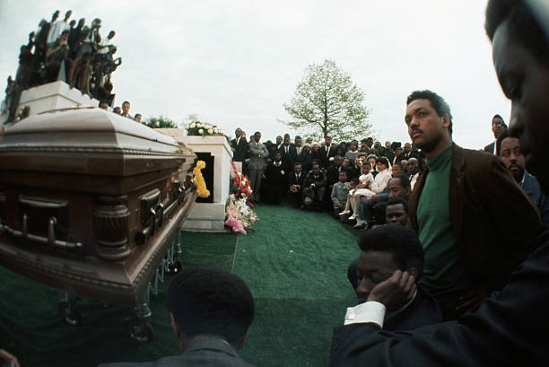 The King family and mourners gather for the burial service at South View Cemetery for Martin Luther King Jr..