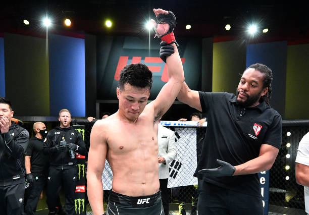 The Korean Zombie' Chan Sung Jung of South Korea reacts after his victory over Dan Ige in a featherweight bout during the UFC Fight Night event at...