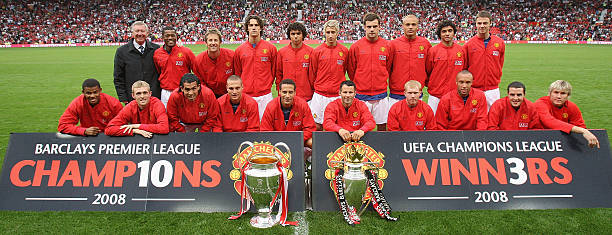 The Manchester United squad pose with the FA Barclays Premiership trophy and the UEFA Champions League trophy ahead of the pre-season friendly match...