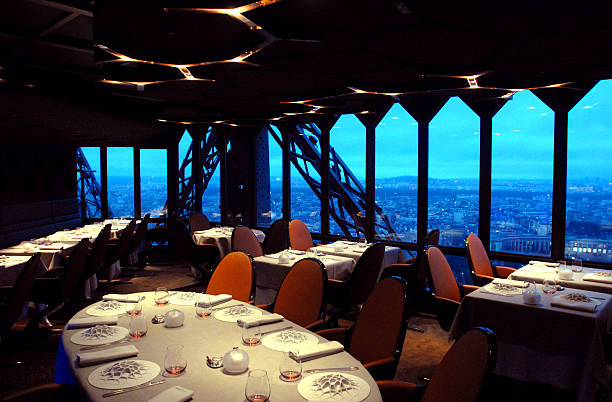 The Paris Cityscape At Dusk Is Viewed From The Dining Room O