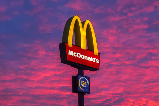 the sky turns red as the sun sets behind a mcdonalds restaurant in picture id1200927820?k=20&m=1200927820&s=612x612&w=0&h=XoQwUR5jBa8F4dLYxk8W