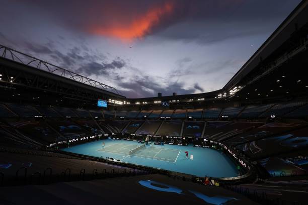 The sun sets as Serena Williams of the US hits a return against Romania's Simona Halep during their women's singles quarter-final match on day nine...