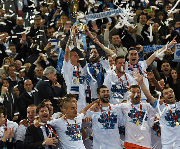 The team of SSC Napoli holds the trophy after winning the TIM Cup final match between ACF Fiorentina and SSC Napoli at Olimpico Stadium on May 3 2014...