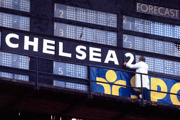 The Wembley ground staff signal Chelsea's second goal on the stadium scoreboard.