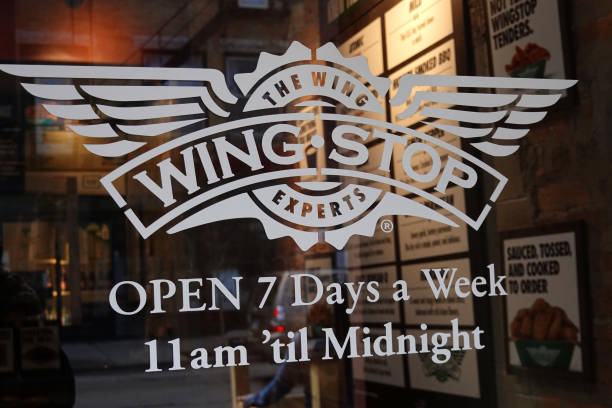 the wingstop logo is seen on the front door of one of the companys picture id1316693205?k=20&m=1316693205&s=612x612&w=0&h=tzC93V5ybHGcTuxeSLYgISXUd rIORXMBQdGw5G4jhY=