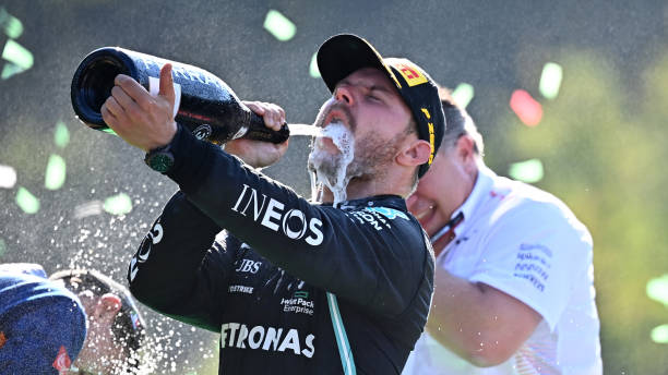 Third placed Valtteri Bottas of Finland and Mercedes GP celebrates on the podium during the F1 Grand Prix of Italy at Autodromo di Monza on September...