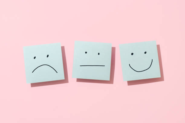 three blue sticky blank notes on pink background - emotions stock pictures, royalty-free photos & images