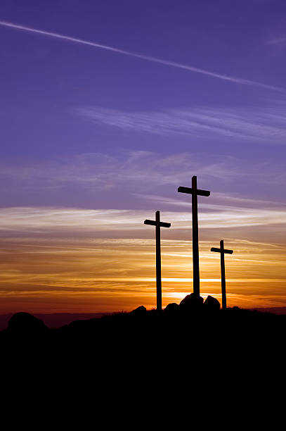 three crosses at sunset - good friday stockfoto's en -beelden