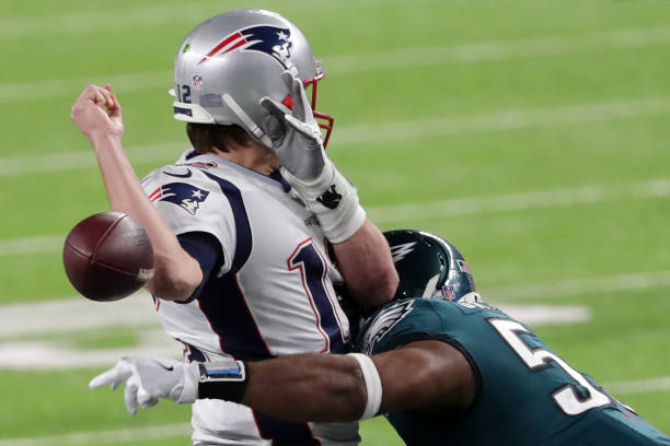 Tom Brady of the New England Patriots has the ball stripped by Brandon Graham of the Philadelphia Eagles late in the fourth quarter in Super Bowl LII...