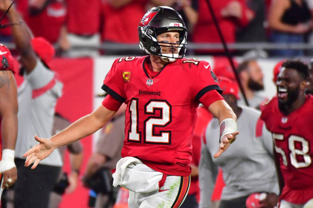 Tom Brady of the Tampa Bay Buccaneers celebrates a 58-yard game-winning touchdown pass to Breshad Perriman in overtime against the Buffalo Bills at...