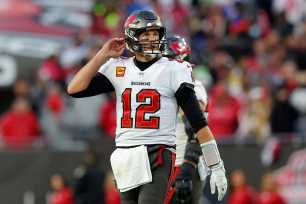 Tom Brady of the Tampa Bay Buccaneers reacts in the fourth quarter of the game against the Los Angeles Rams in the NFC Divisional Playoff game at...