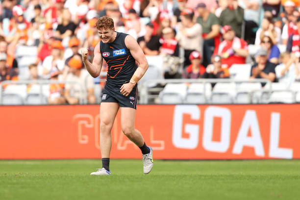 Tom Green of the Giants celebrates kicking a goal during the round one AFL match between the Greater Western Sydney Giants and the Sydney Swans at...