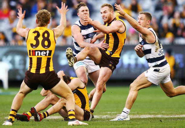 Tom Mitchell of the Hawks kicks the ball during the round 21 AFL match between the Hawthorn Hawks and the Geelong Cats at Melbourne Cricket Ground on...