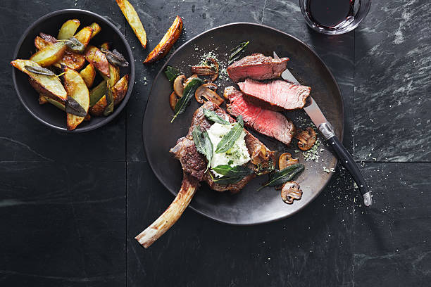 tomahawk beef steak with mushrooms burrata and sage potato wedges picture