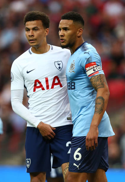 Tottenham Hotspur's Dele Alli and Newcastle United's Jamaal Lascelles during the English Premier League match between Tottenham Hotspur and Newcastle...