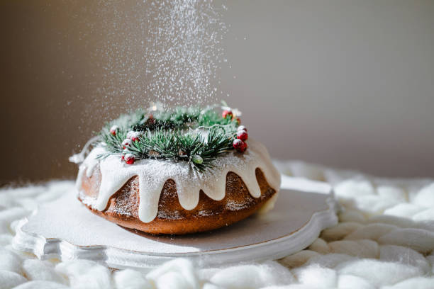 traditional christmas lemon bundt cake decorated with spruce branch picture