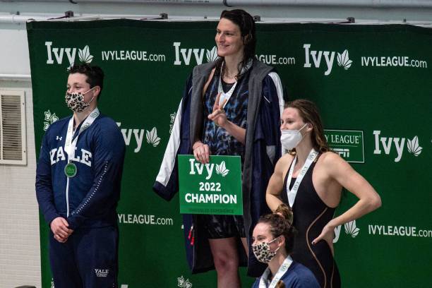 Transgender swimmer Lia Thomas of Penn University and transgender swimmer Iszac Henig of Yale pose with their medals after placing first and second...