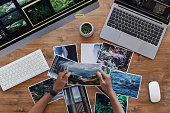 Travel Photographer Holding Pictures Top View