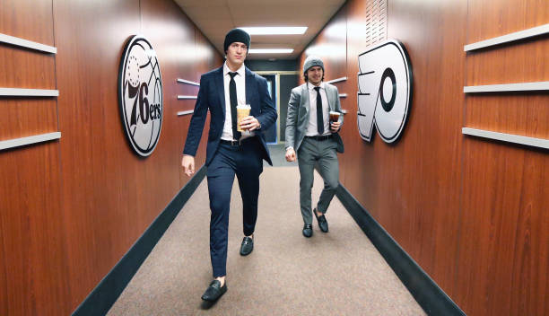 Travis Sanheim and Travis Konecny of the Philadelphia Flyers enter the building on route to the locker room prior to their game against the New York...
