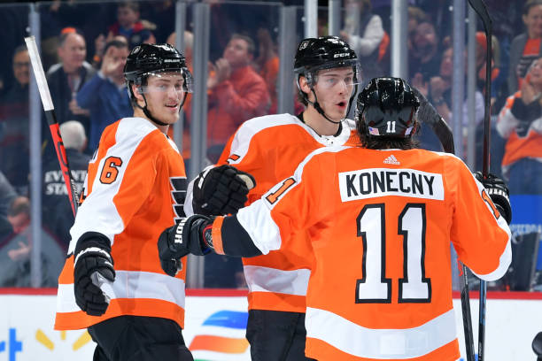 Travis Sanheim, Philippe Myers and Travis Konecny of the Philadelphia Flyers celebrate a goal against the Montreal Canadiens during the first period...